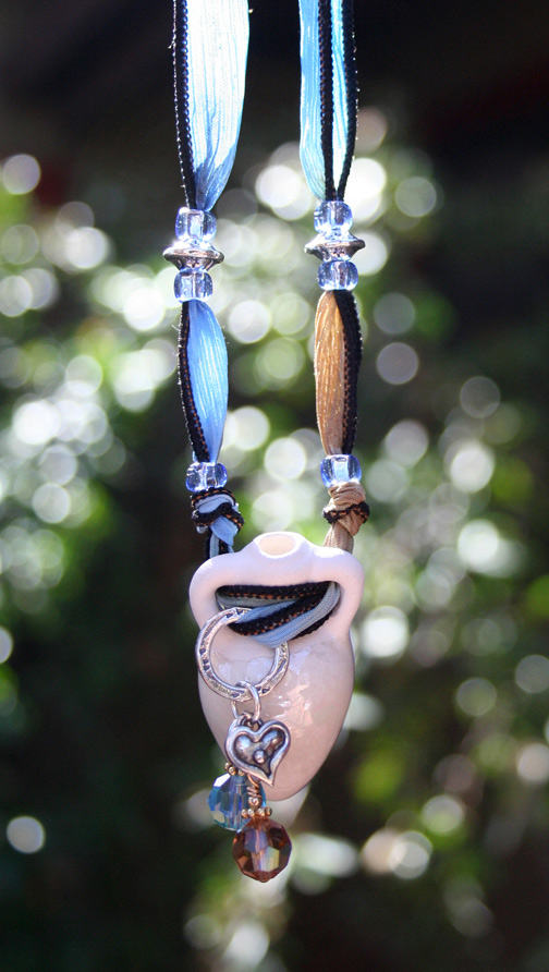 aromatherapy necklace with silver charms and Swarovski crystals