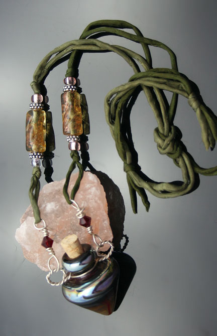 Aromatherapy necklace with earth-tone artisan glass bottle, olive-green silk cord and wonderful beads