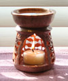 Photo of our medium-sized soapstone aromatherapy diffuser featuring elegantly carved rose vines
